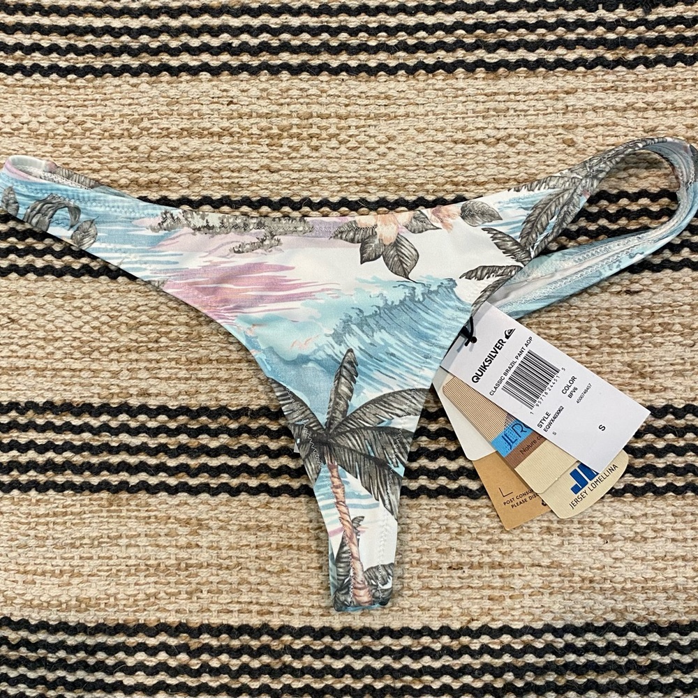 Quicksilver thong swim bottoms. Size small tropical print